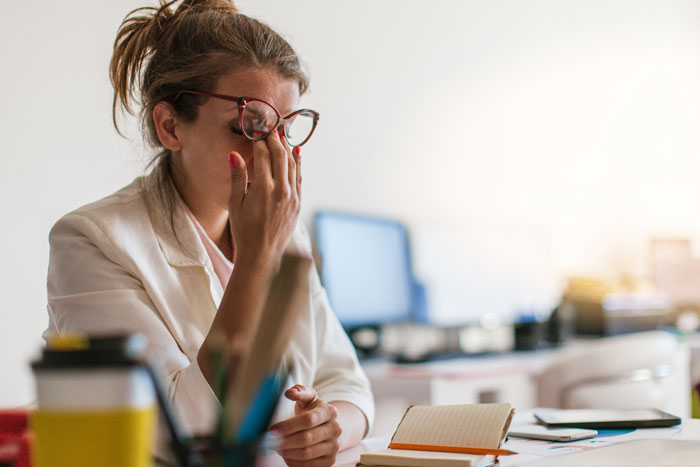 young female experiencing work-related stress