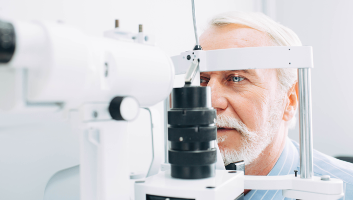 elderly man getting eye exam for cataracts